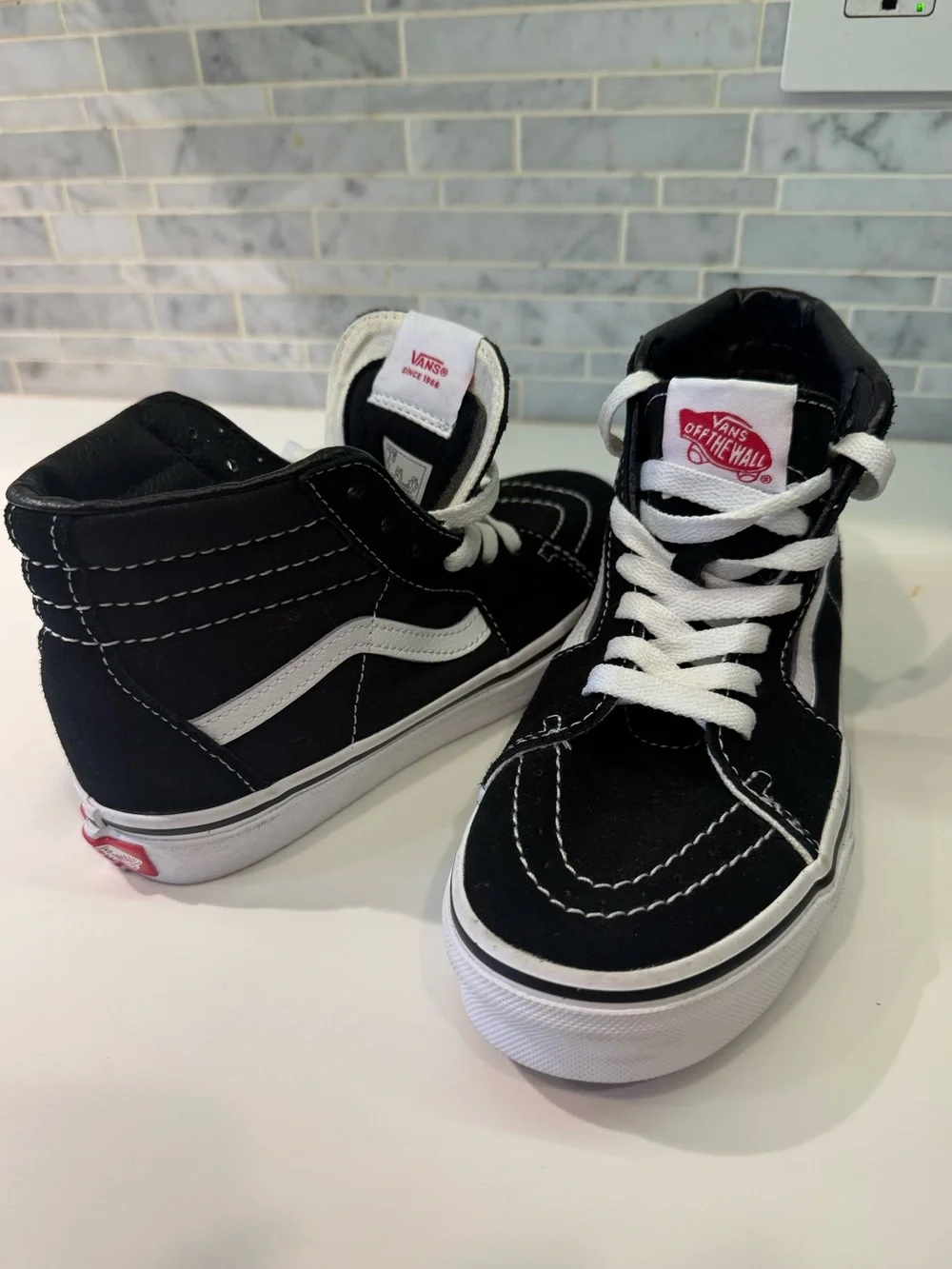 Vans Black and White Suede/Leather High-Top Sneakers with Red Logo